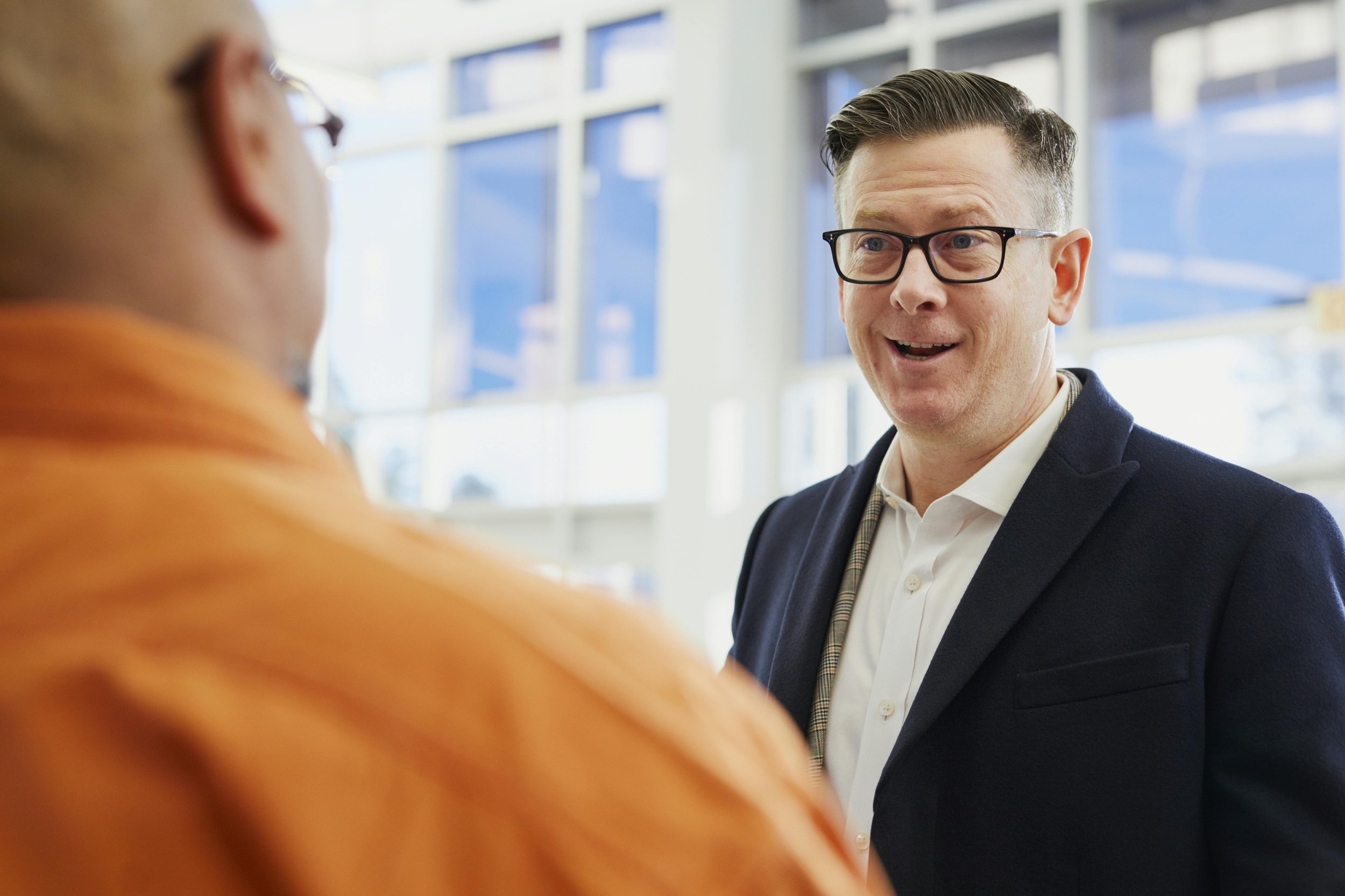 Two professionals having a conversation