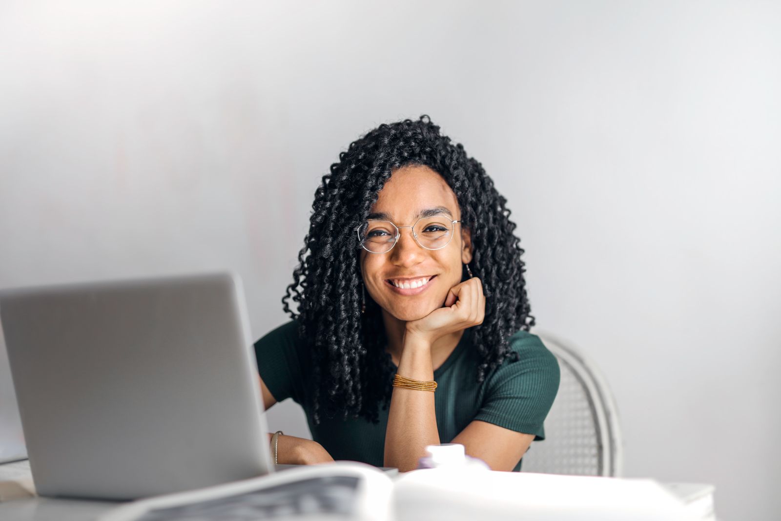 Smiling professional at her workspace